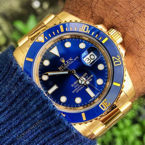 gold Rolex with blue face